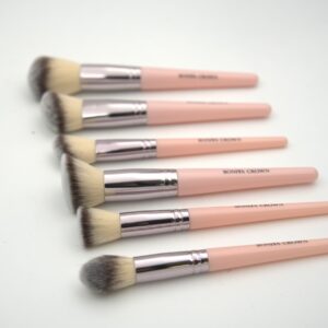 Close-up of Bonita Crown face makeup brushes with pink handles